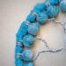 details of acrylic yarn and 8mm marble blue look glass beads